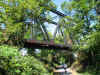 Rusty railroad bridge over the bike trail