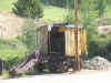 Old steam shovel with bent arm, needs a lot of repairs