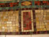 Closeup of mosaic tiles in subway station